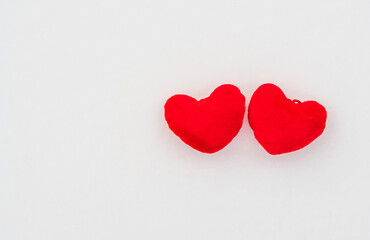 Poster - Two red hearts lie on a white background (snow), Valentine's Day