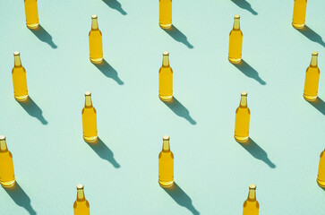 Leinwandbilder - Several beer bottles with long shadows on light blue background.