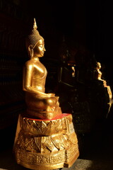 Wall Mural - The golden Buddha image. Reverence in Buddhist sutras At Wat Luang Pothit, Thailand