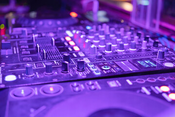 Mixes on CD players or track at nightclub during party for DJ. Nightlife of disco club in disco pub club bar background for party music dancing festival performance. Entertainment nightlife.