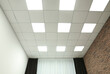 © New Africa - White ceiling with lighting in office room