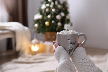 Wall Mural - Woman with delicious hot drink at home, closeup. Space for text