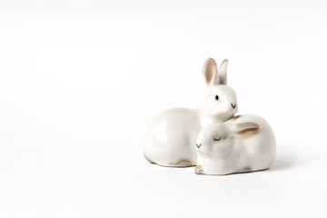 ceramic white hares, vintage figurine on a white background