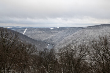 Wall Mural - Beautiful shot of snow-covered hills on a winter day