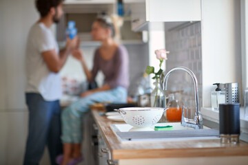 Wall Mural - A young couple in love at the kitchen. Cooking, home, kitchen, relationship