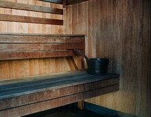 Traditional Wooden Scandinavian Sauna With Water Bucket