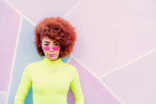 Portrait Of Woman With Afro Hair And Pink Glasses