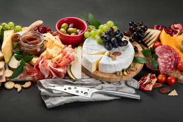 Wall Mural - Appetizers table. Cheese, fuits and meat board