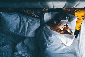 Woman sleeping with a sleep mask on her eyes