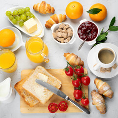 Poster - Delicious fresh breakfast served with drinks, croissants and fruits.