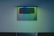 © Cavan Images - Laptop computer standing on a table, low key blue light image sh