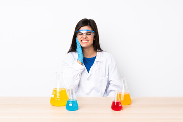 Young scientific woman in a table with toothache