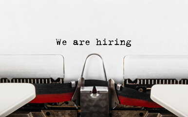 Poster - text we are hiring typed on retro typewriter