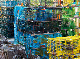 Lobster traps stacked on top of each other on a dock in Maine