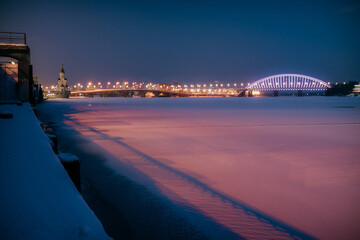 Poster - Havana bridge and Podilskyi Bridge in Kyiv at winter night with colorful illumination and the frozen Dnipro river