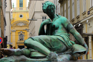 Wall Mural -  A sculpture of a green woman installed at the Donnerbrunnen fountain in Vienna.