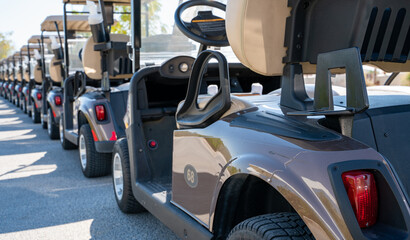 Wall Mural - Background image of multiple golf carts parked in order.