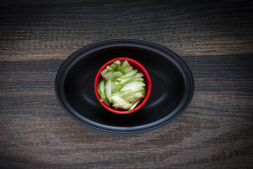 Closeup shot of small pieces of cucumber in a bowl