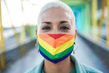 Portrait Of Young Lesbian Wearing Rainbow Flag Pride Mask - Focus On Face