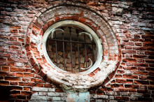Fragment Of An Ancient Brick Wall With A Window With A Lattice Of A Medieval Church As Texture Or Background