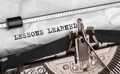 Aufkleber - Text LESSONS LEARNED typed on retro typewriter
