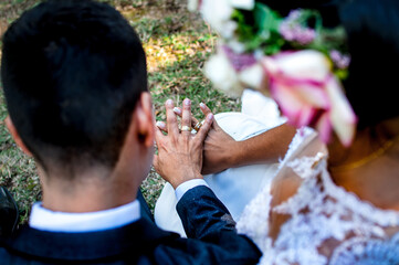 Poster - High angle shot of a bride and groom with rings during a weddiceremony