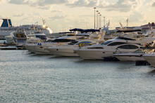 The Snow-white Yachts, Moored In The Seaport, Are Lined Up In A Row, Of Different Models And Types. Russia City Of Sochi.