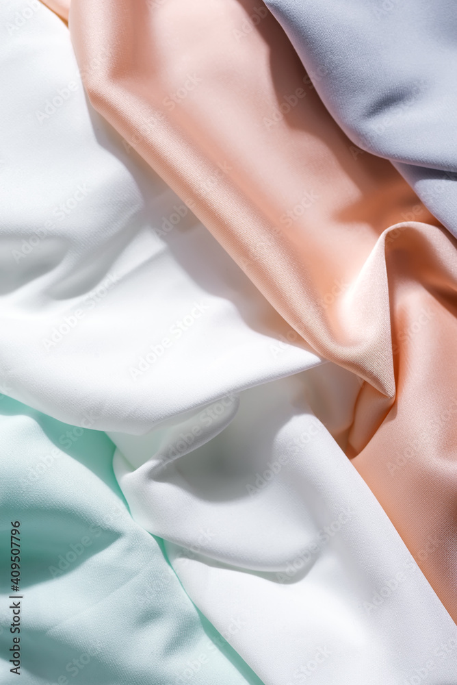 beautiful silk fabric of delicate multy color draped with small folds, softly flowing, - obrazy, fototapety, plakaty 