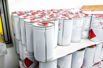 Wall Mural - Metal tin containers for storing chemicals, chemistry background, industry waste management