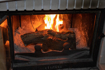 Classic fireplace with log burning.