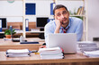 © Elnur - Young male employee unhappy with excessive work