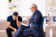 © Elnur - Young man visiting old male psychologist