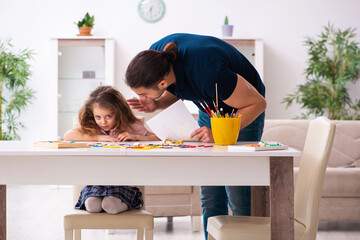 Poster - Young father and little girl indoors