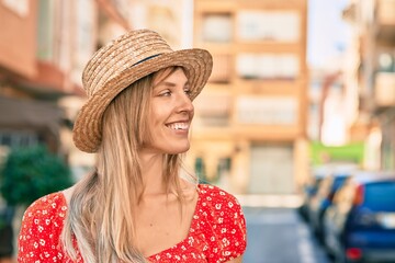 Poster - Young blonde tourist woman wearing summer style walking at the city.