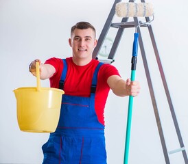 Wall Mural - Male painter preparing for painting job at construction site