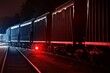 Large cargo train with goods leaving the terminal at night, wagons (containers) close-up. Concept urban scene. Illumination, red light. Freight transportation, industry, business, logistics, delivery