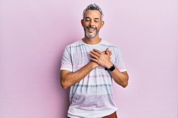 Sticker - Middle age grey-haired man wearing casual clothes smiling with hands on chest with closed eyes and grateful gesture on face. health concept.