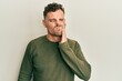 © Krakenimages.com - Young hispanic man wearing casual clothes touching mouth with hand with painful expression because of toothache or dental illness on teeth. dentist