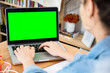 © uplightpictures - Woman entrepreneur using laptop while working in office, green screen