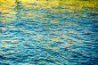 Abstract water background. Water ripples with reflections