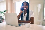 Fototapeta  - Young african american woman smiling happy working using laptop at home