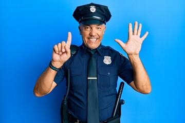 Poster - Handsome middle age mature man wearing police uniform showing and pointing up with fingers number six while smiling confident and happy.