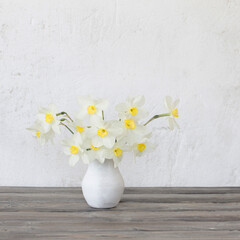 Wall Mural - narcissus in vase on wooden table