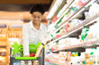 © Prostock-studio - Female Customer Putting Grocery Products In Shop Cart In Supermarket
