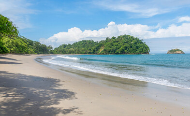 Wall Mural - Manuel Antonio beatiful tropical beach with white sand and blue ocean. Paradise. National Park in Costa Rica, Central America.