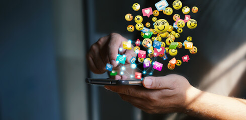 Man using smartphone sending text messages emoticon icons. Social network concept, 3d rendering