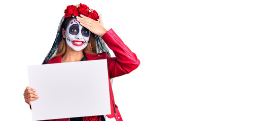 Sticker - Woman wearing day of the dead costume holding blank empty banner stressed and frustrated with hand on head, surprised and angry face