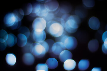 Bokeh christmas lights defocused on black background