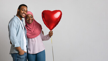 Wall Mural - African american muslim couple with love balloon