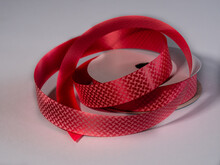 Christmas Or New Year Red Speckled Ribbon On A Bright Background For Gifts For The Holiday